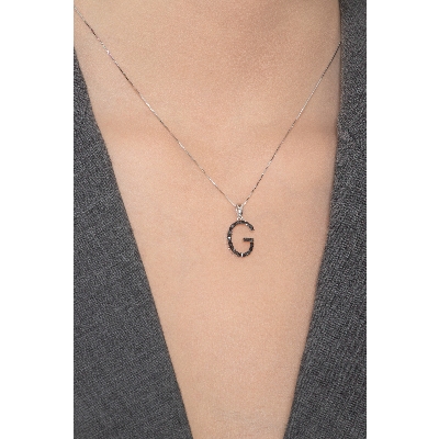 18k white gold letter G with black diamonds