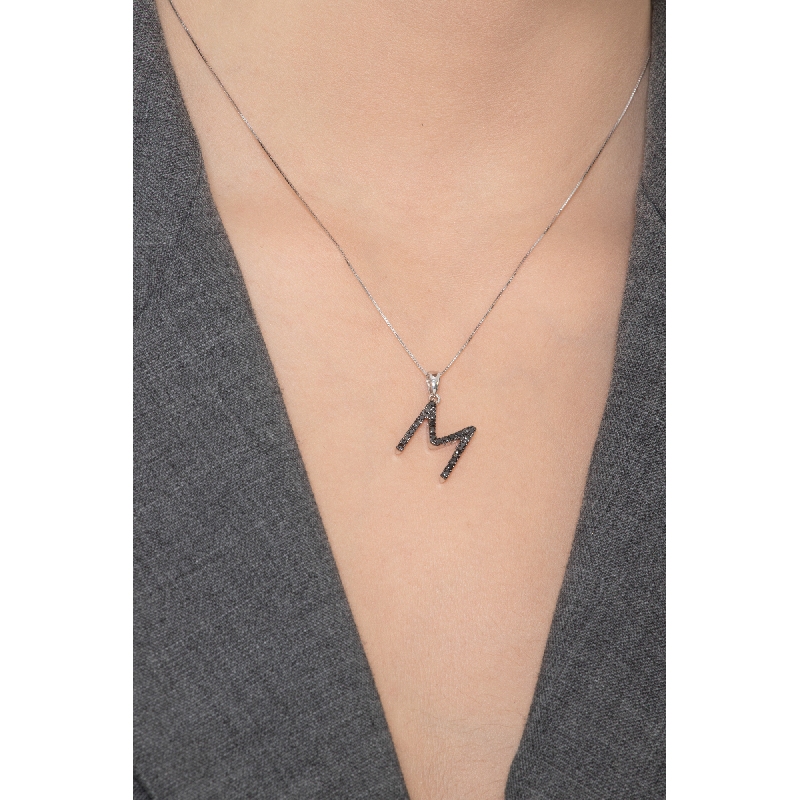 18k white gold letter M with black diamonds