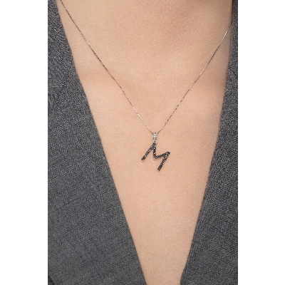 18k white gold letter M with black diamonds