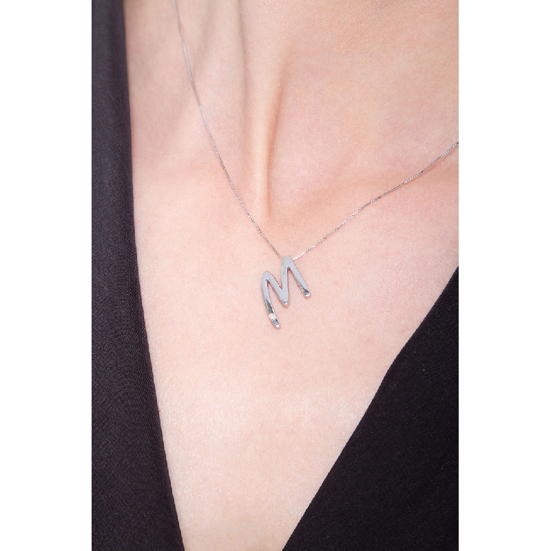 18k white gold letter M with solitaire diamond