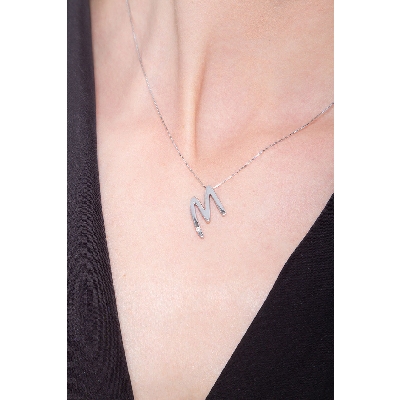 18k white gold letter M with solitaire diamond