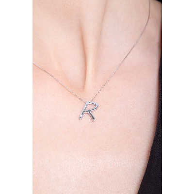 18k white gold letter R with solitaire diamond