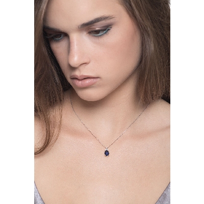 18k white gold necklace with diamonds and oval cut sapphire pendant