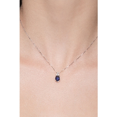 18k white gold necklace with diamonds and oval cut sapphire pendant