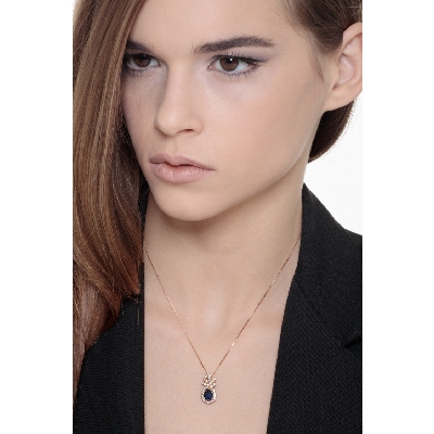 18k rose gold blue sapphire pendant with round cut diamonds
