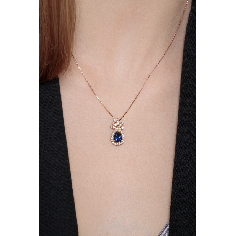 18k rose gold blue sapphire pendant with round cut diamonds