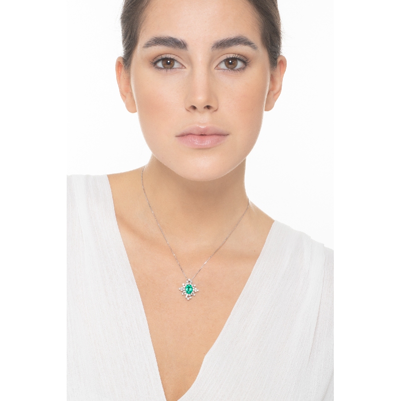Oval emerald pendant with wire setted diamond