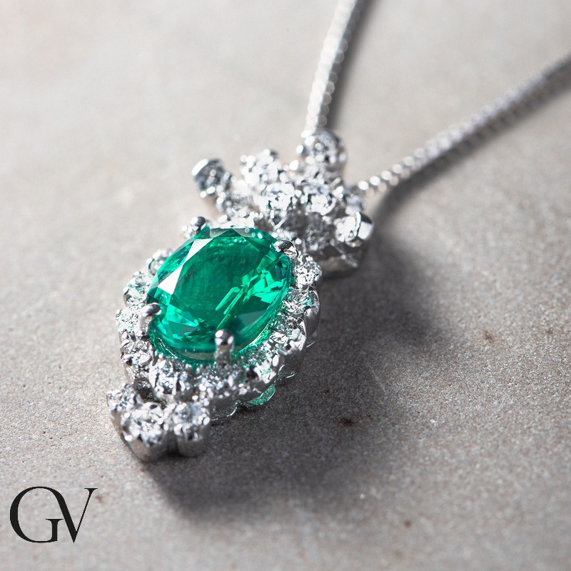 Fancy oval emerald and diamond pendant