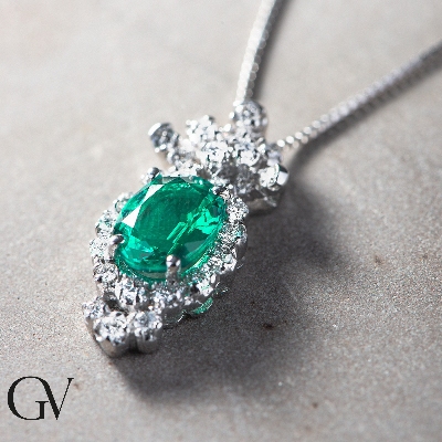 Fancy oval emerald and diamond pendant