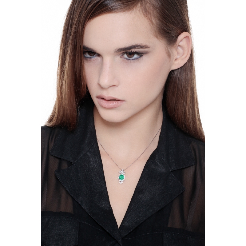 Fancy oval emerald and diamond pendant