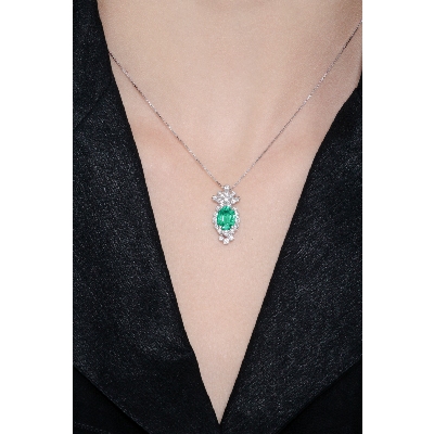 Fancy oval emerald and diamond pendant