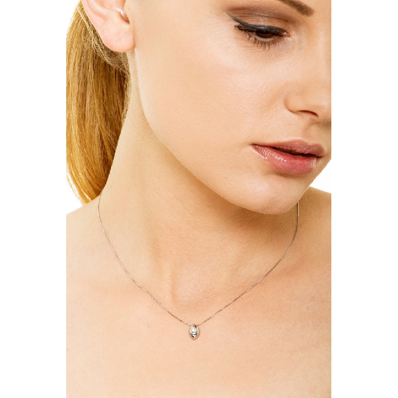 18k white gold solitaire necklace with drop shaped bezel and diamond