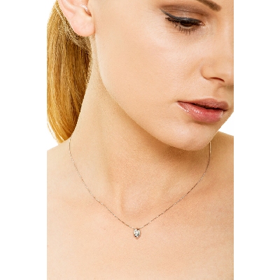 18k white gold solitaire necklace with drop shaped bezel and diamond