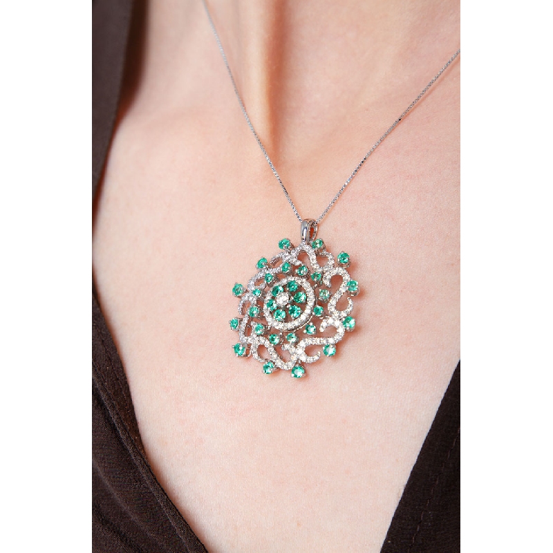 Elegant circle pendant with emeralds and diamonds