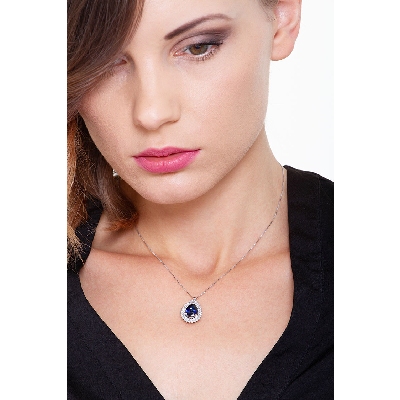 Necklace with pendant, central pear cut blue sapphire and 2 rows of diamonds