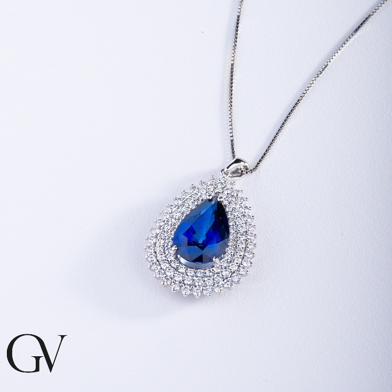 Necklace with pendant, central pear cut blue sapphire and 3 rows of diamonds