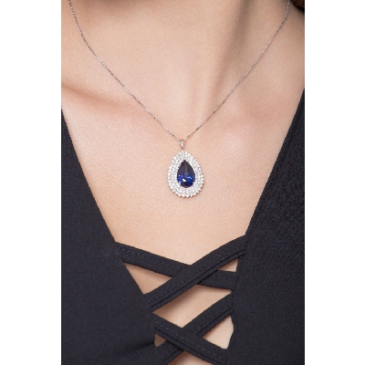 Necklace with pendant, central pear cut blue sapphire and 3 rows of diamonds