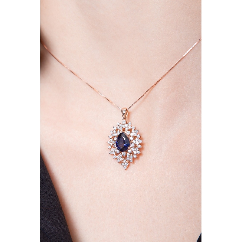 Necklace with pendant, central pear cut sapphire and a fancy crown of diamonds