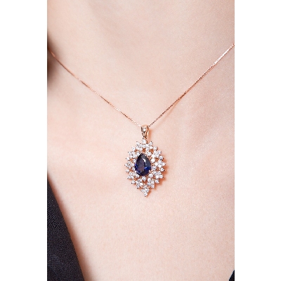 Necklace with pendant, central pear cut sapphire and a fancy crown of diamonds