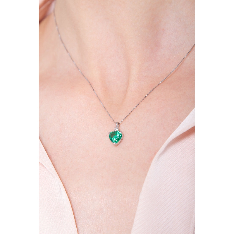 Emerald and diamond pendant in 18k white gold