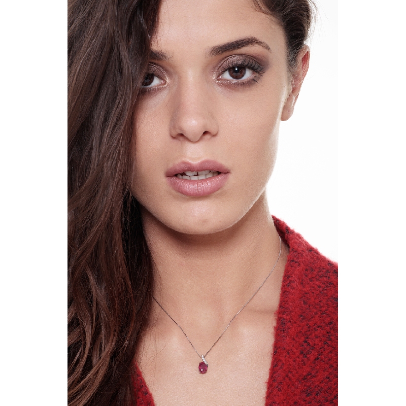Fancy ruby pendant with round cut diamonds