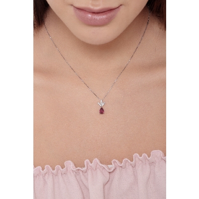 18k white gold pendant with 3 diamond leaves and ruby