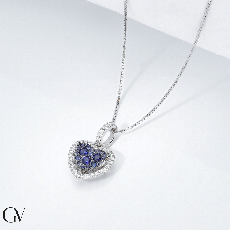 Fancy heart pendant with diamond and blue sapphires 