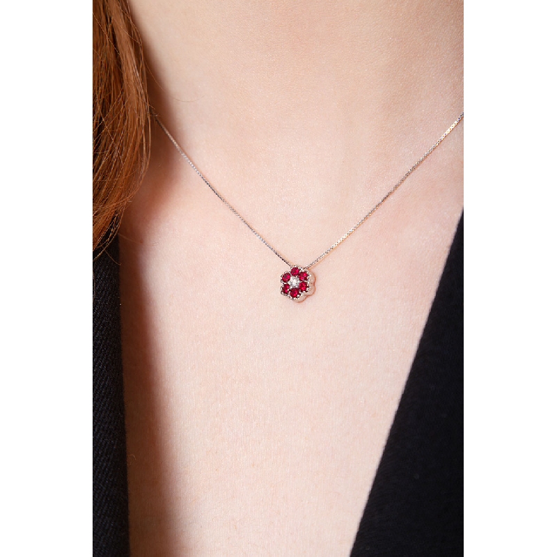 18k white gold flower pendant with rubies and diamonds