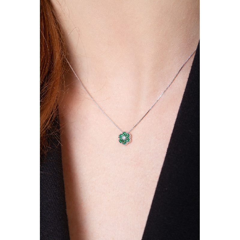 18k white gold flower pendant with emeralds and diamonds