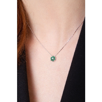 18k white gold flower pendant with emeralds and diamonds