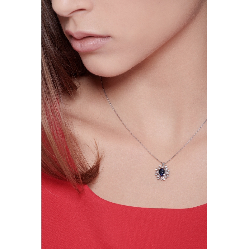 Necklace with pendant, central blue sapphire and a fancy diamonds crown