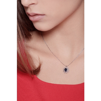 Necklace with pendant, central blue sapphire and a fancy diamonds crown