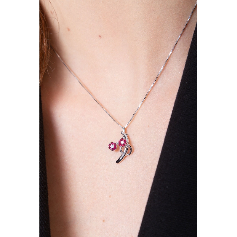 18k white gold pendant with 2 wires, rubies and diamonds