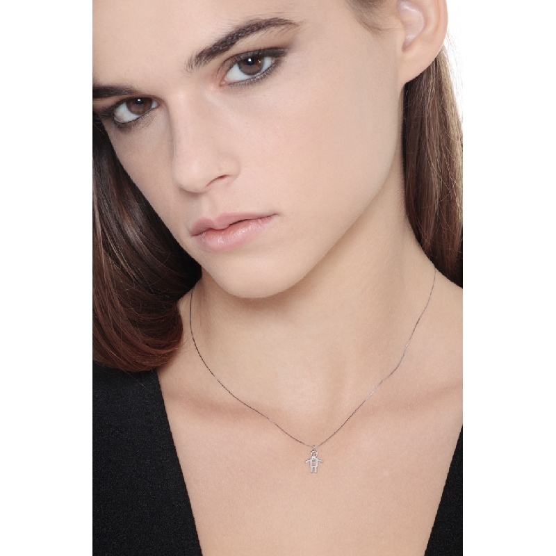 White gold 18k pendant with boy silhoutte and a diamond 