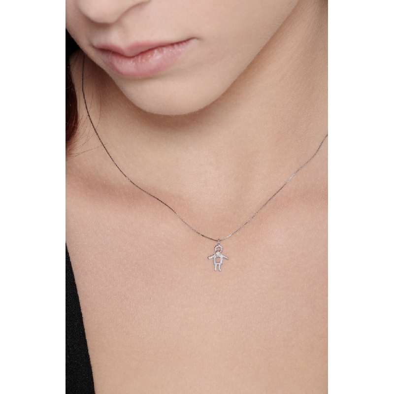White gold 18k pendant with boy silhoutte and a diamond 