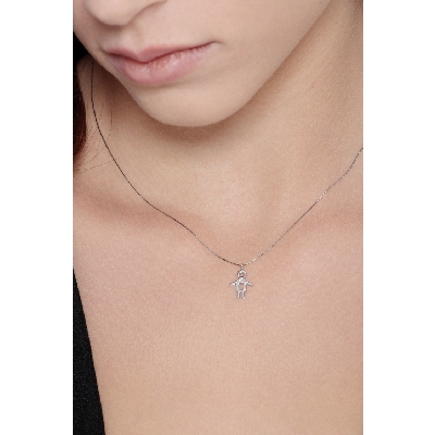 White gold 18k pendant with boy silhoutte and a diamond 