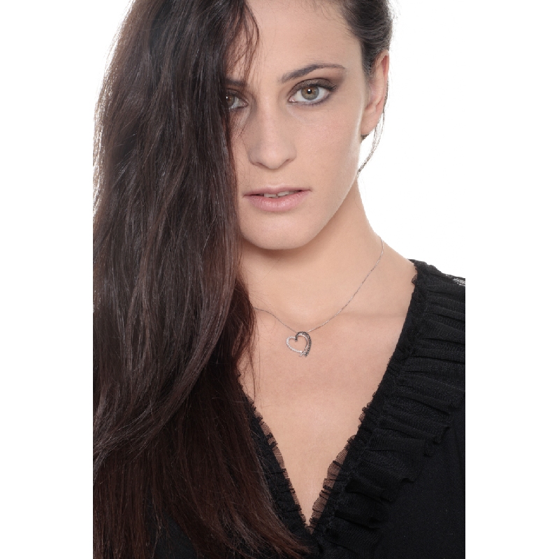Heart shape pendant with black and white diamonds