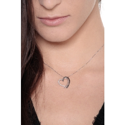 Heart shape pendant with black and white diamonds