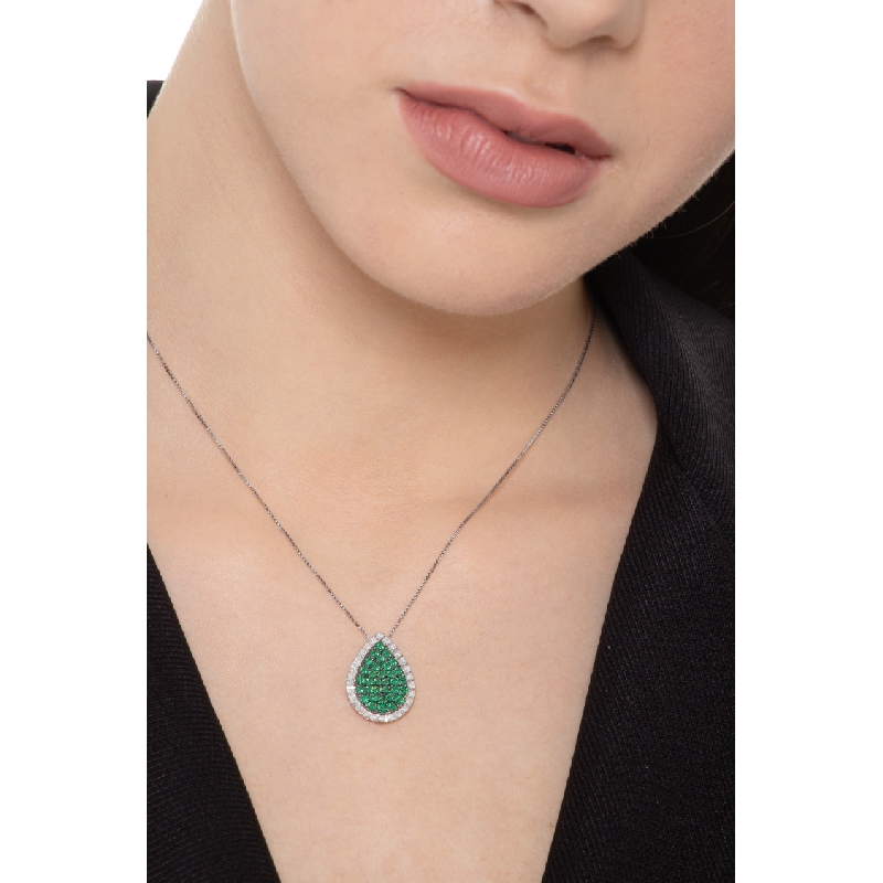 18k white gold drop shaped pendant with emeralds and diamonds