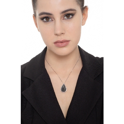 18k white gold drop shape pendant with black and white diamonds