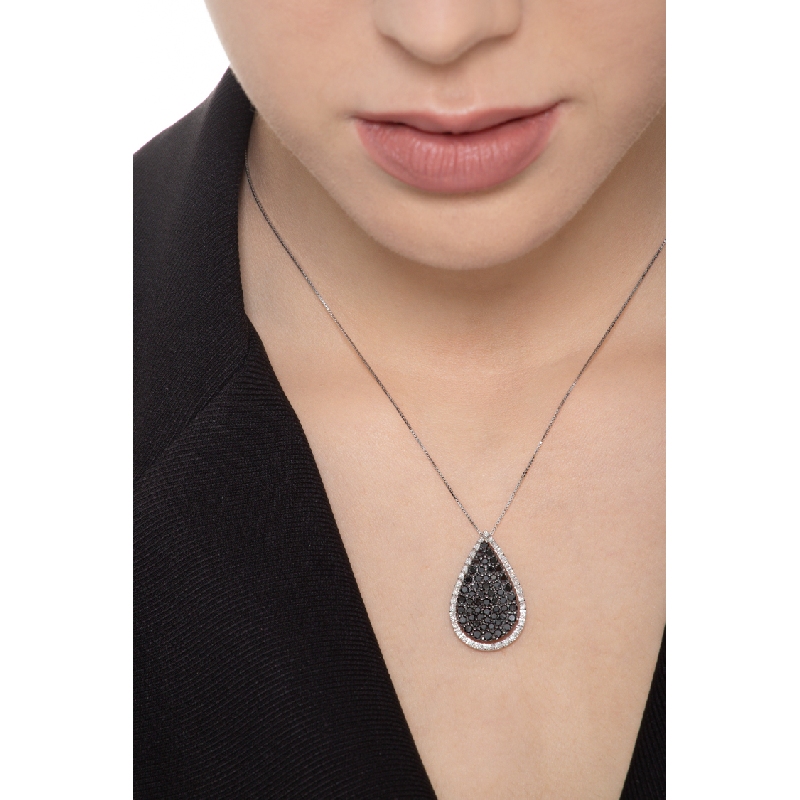 18k white gold drop shape pendant with black and white diamonds