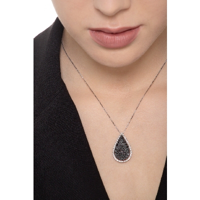 18k white gold drop shape pendant with black and white diamonds