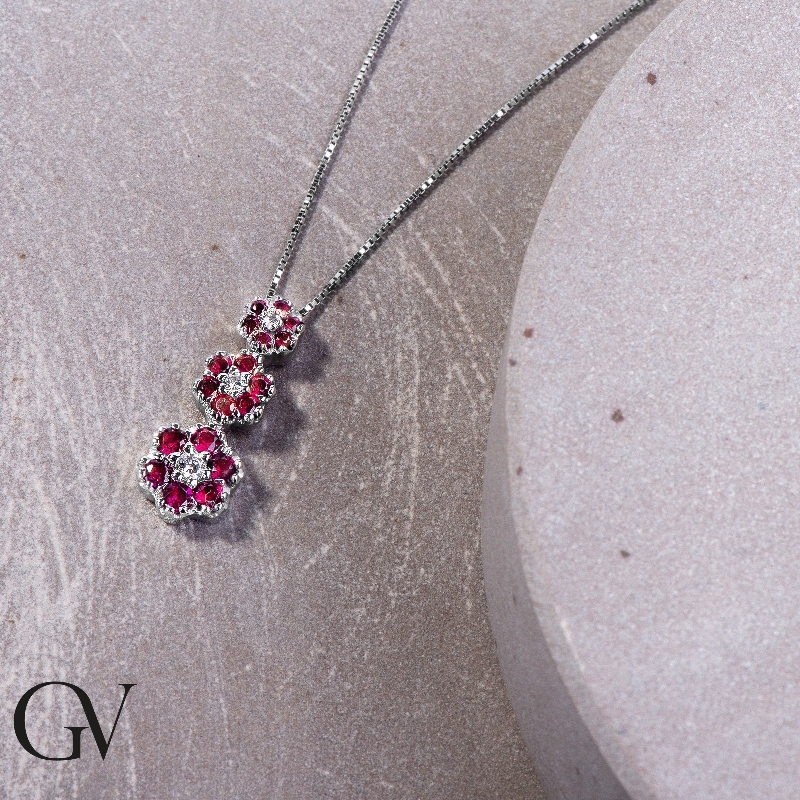 Ruby and diamond flowers pendant in 18k white gold