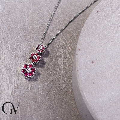 Ruby and diamond flowers pendant in 18k white gold