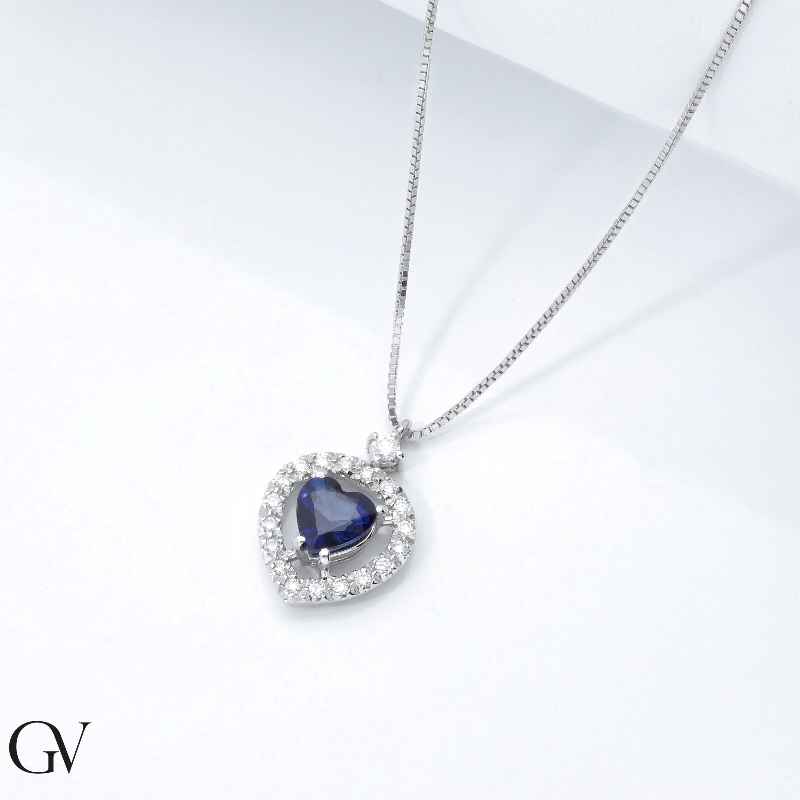Halo necklace with blue sapphire and diamonds