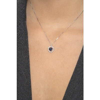 Halo necklace with blue sapphire and diamonds