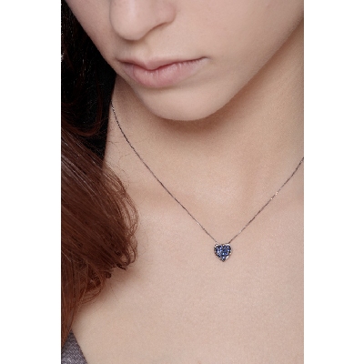 Burnished heart pendant with blue sapphires