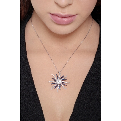 18k white gold necklace with sun pendant with sapphires and round cut diamonds