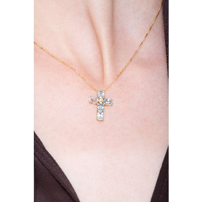 18 yellow gold cross pendant with aquamarine and solitaire diamond