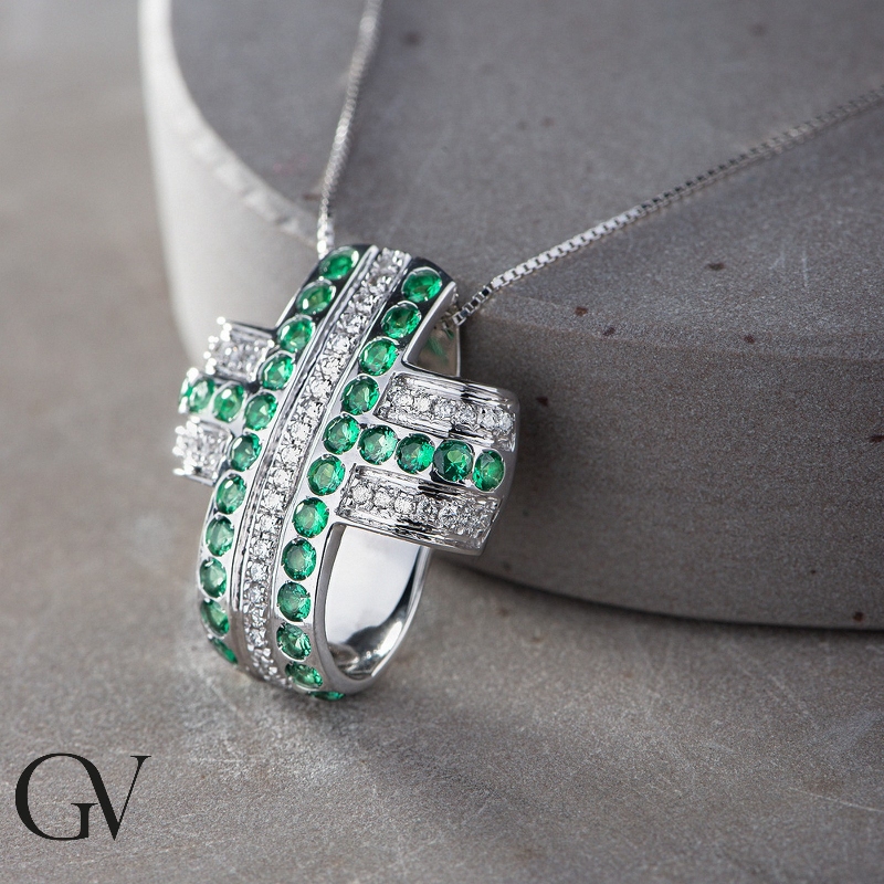 Rounded cross pendant with emeralds and diamonds